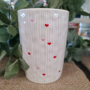 Candle in heart vase