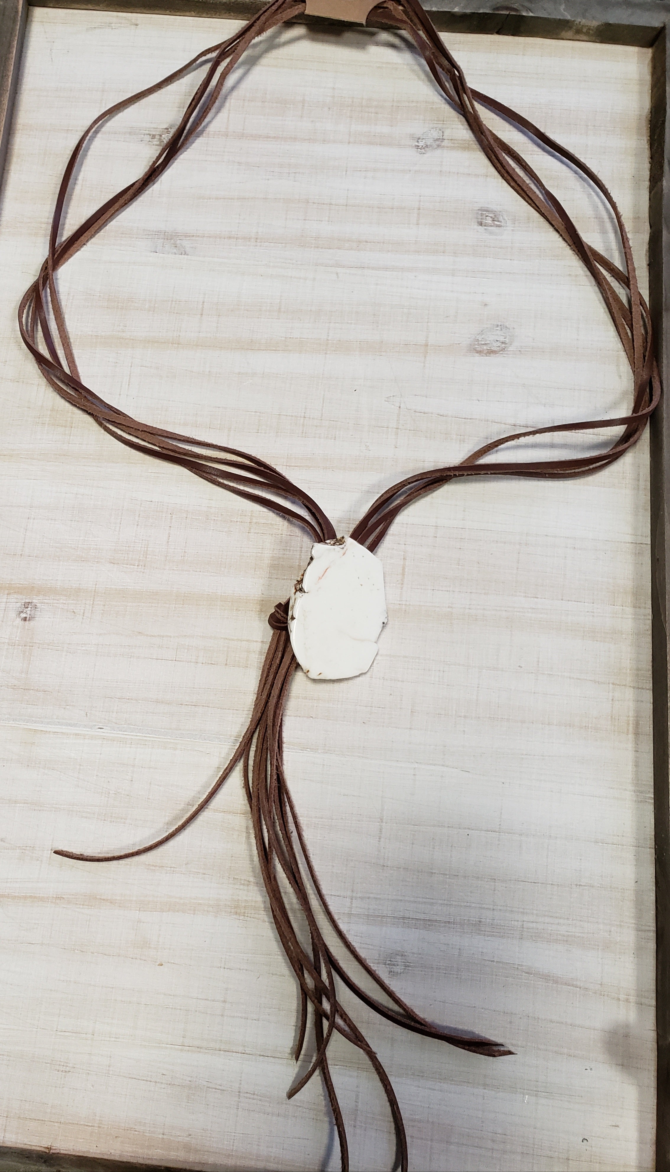 White stone and leather necklace