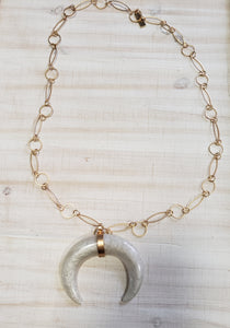 Gold chain and half cresent pendant necklace