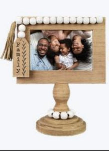 Wooden tabletop photo frame on a pedestal