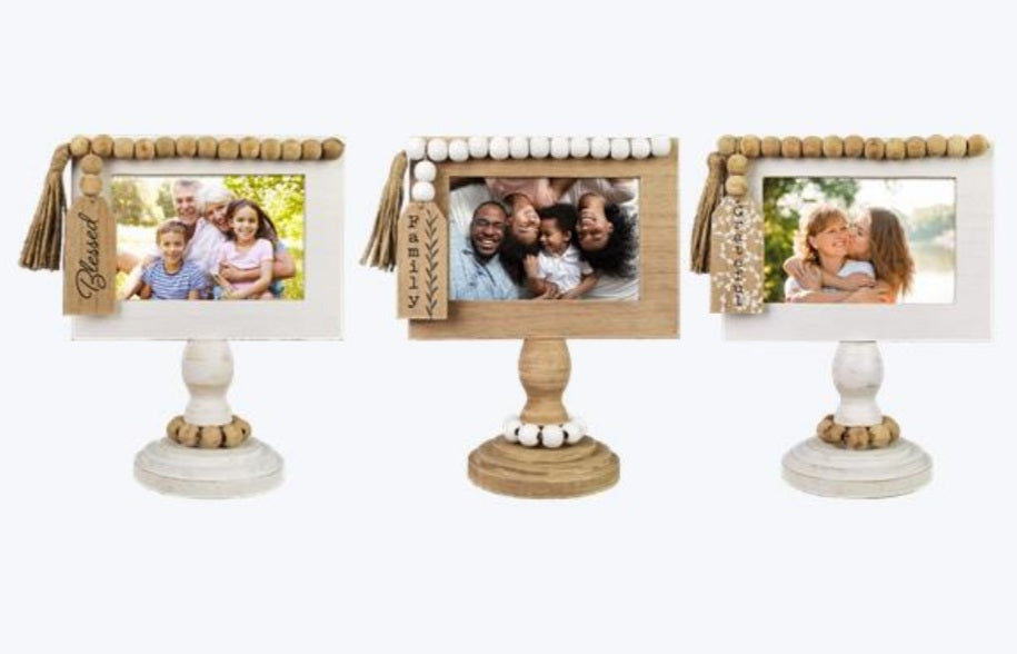 Wooden tabletop photo frame on a pedestal